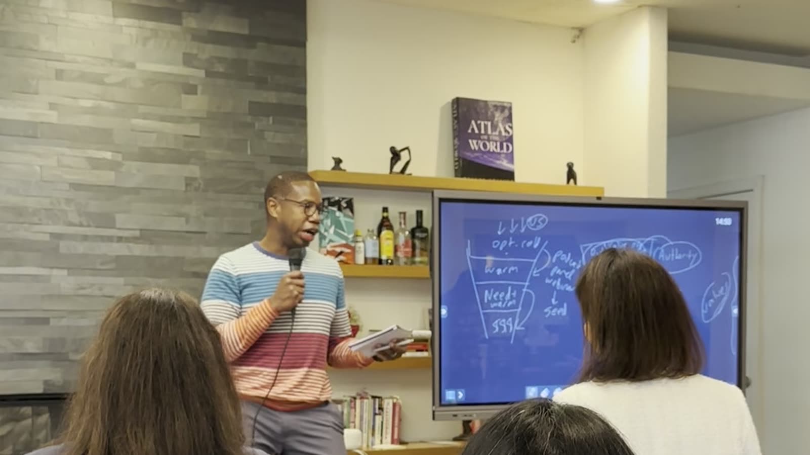 Tyrone Ross delivering a keynote to a live audience